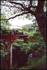 Welsh narrow guage steam train crossing gorge